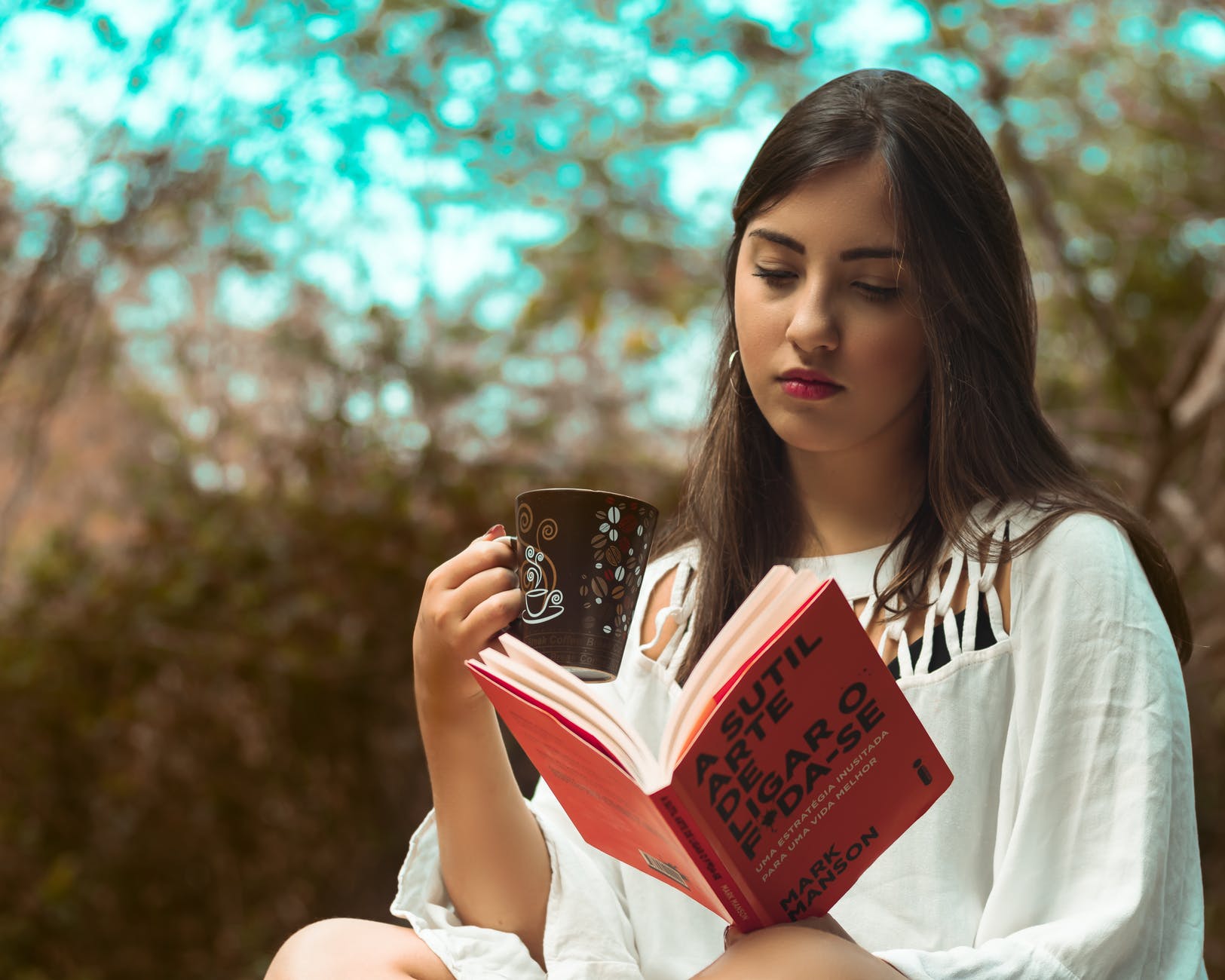 photo of girl reading book